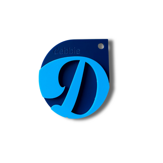 Blue and black tagwith name branding on a white background