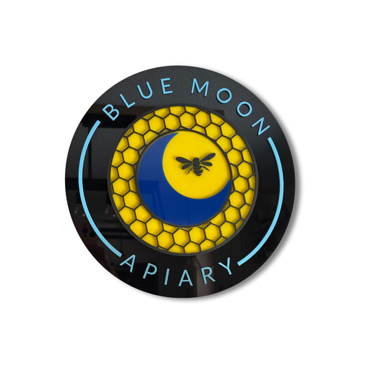 Round logo with 'Blue Moon Apiary' text and honeycomb design on a white background