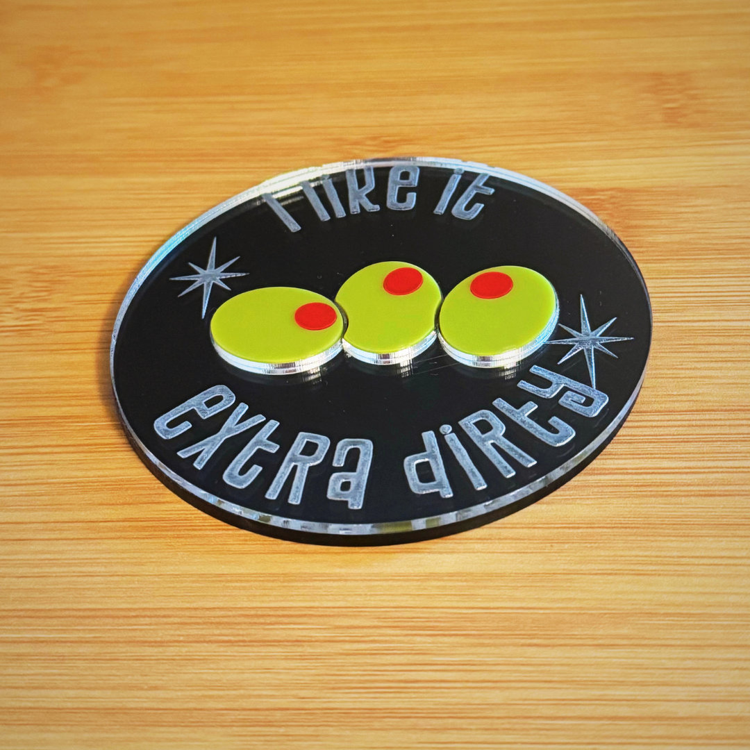 mirror coaster with etched words and inlaid green olives with red pimento