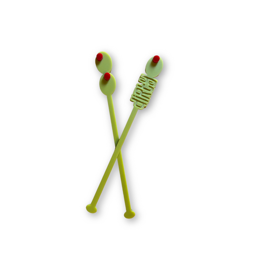 Two green acrylic cocktail stirrers with red olives on a white background