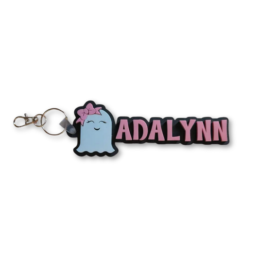 Keychain with cartoon ghost and 'ADALYNN' text on a white background