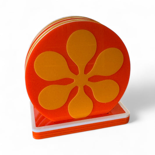 Set of orange retro flower-shaped coasters on a white background