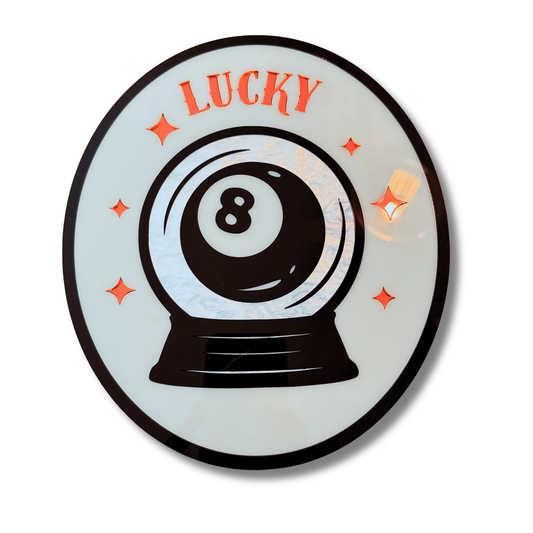 Decorative plate with a crystal ball design featuring the number 8 and the word 'LUCKY'.